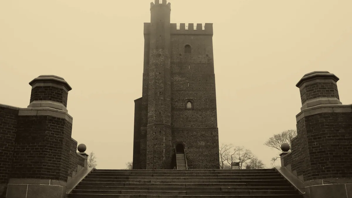 Stone stairs rising through a keep.