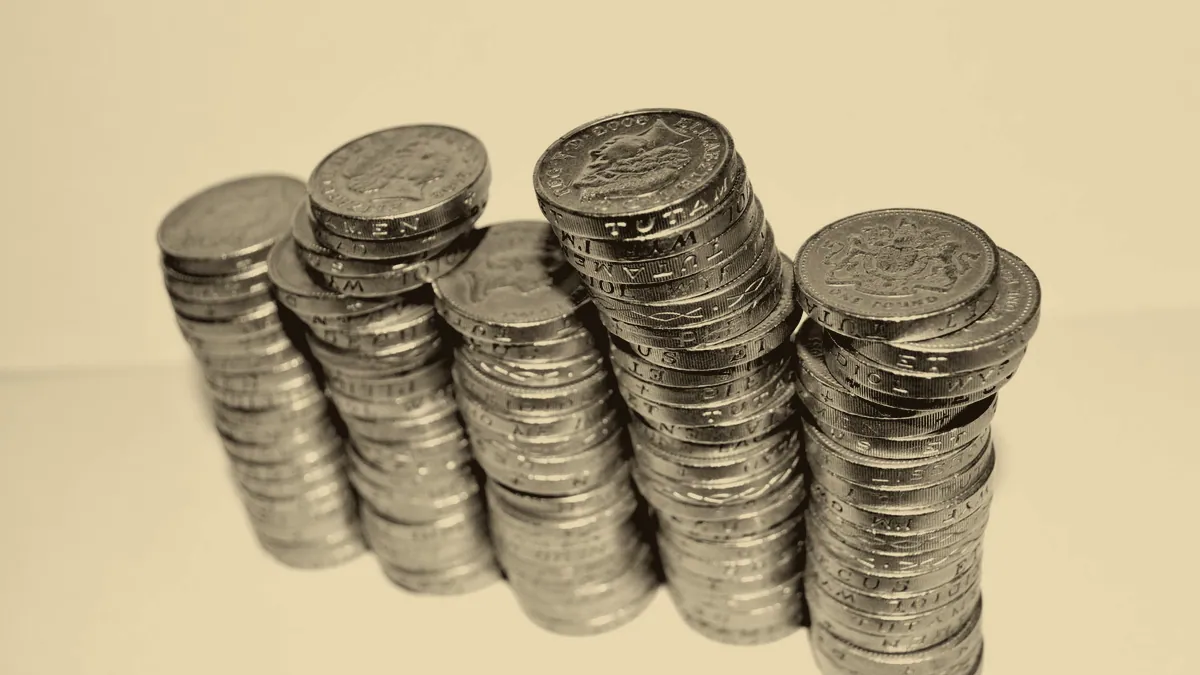 Stacked gold coins, the currency of the realm.