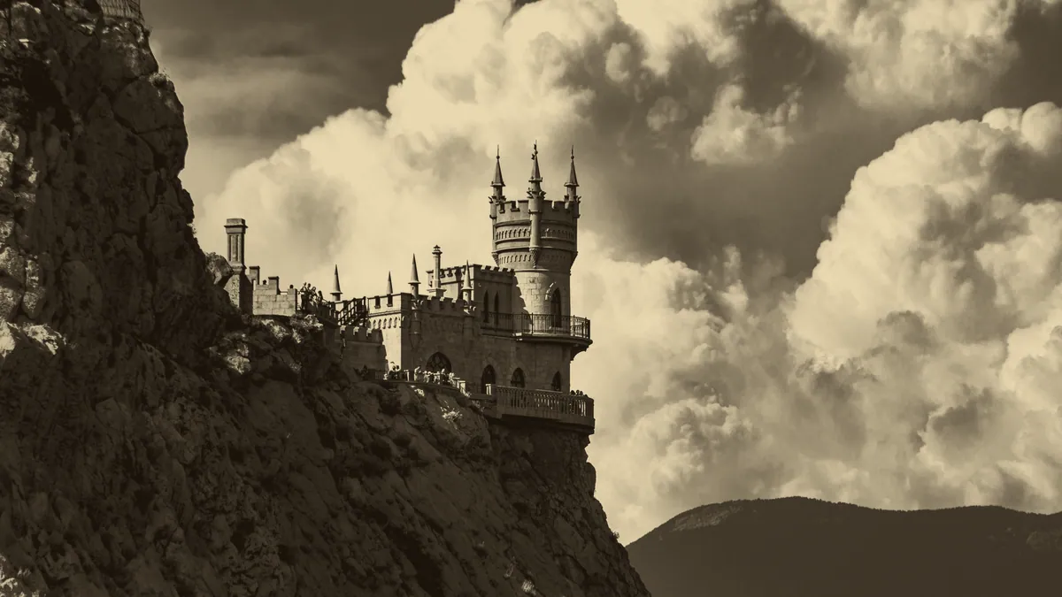 A castle on a ridge at dusk, the kind of realm Lineage 2 is set in.