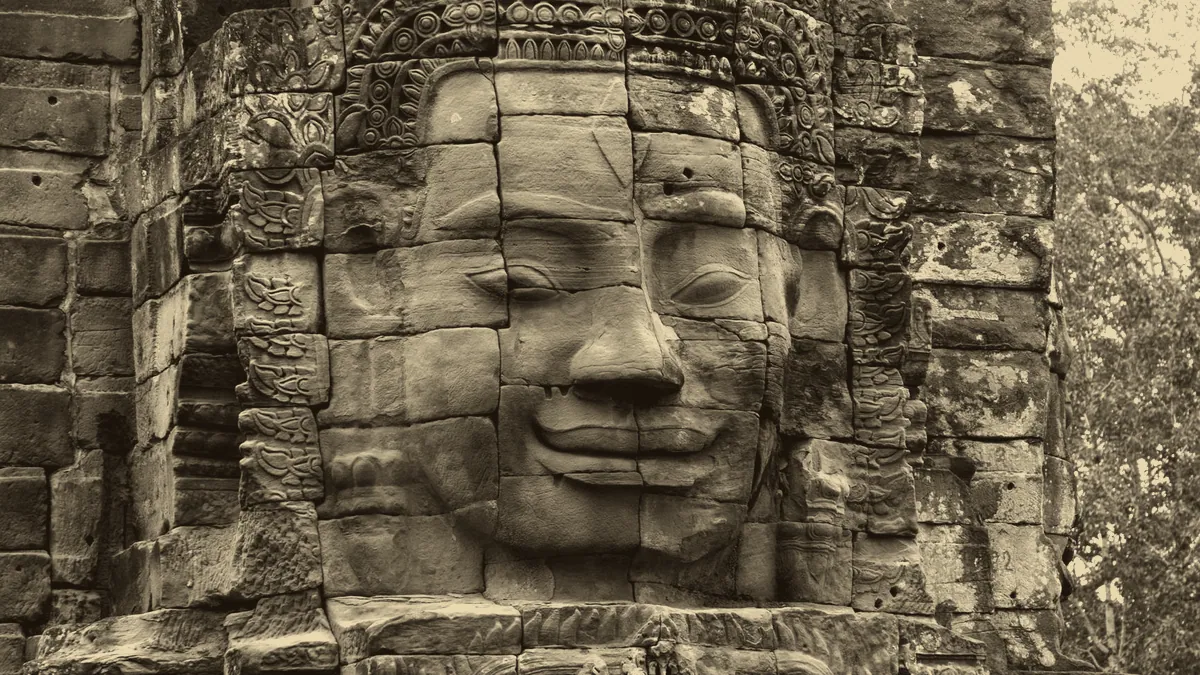 Carved faces in old stone, the many peoples of a world.