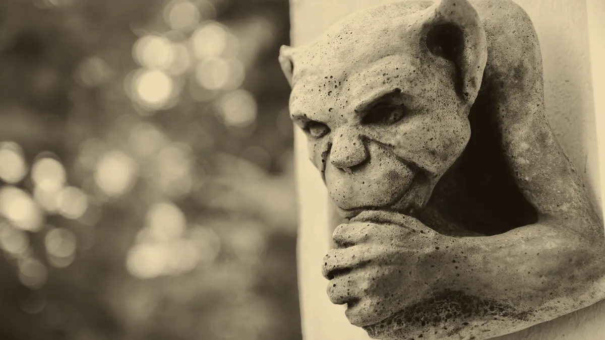 A gargoyle carved in stone.