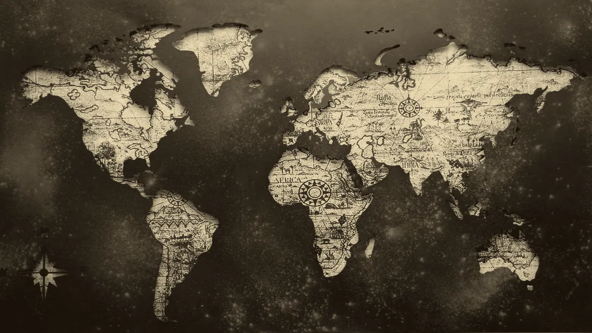 An aged map, one era of the world drawn over another.